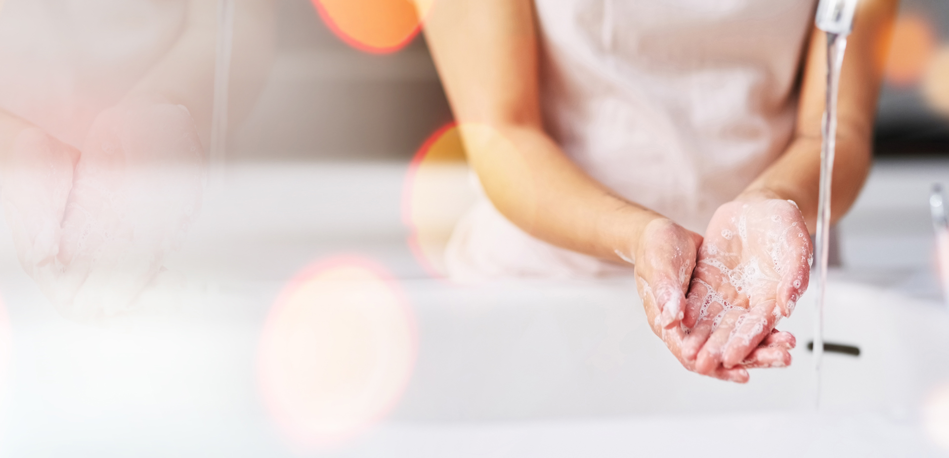 Young woman washing hands